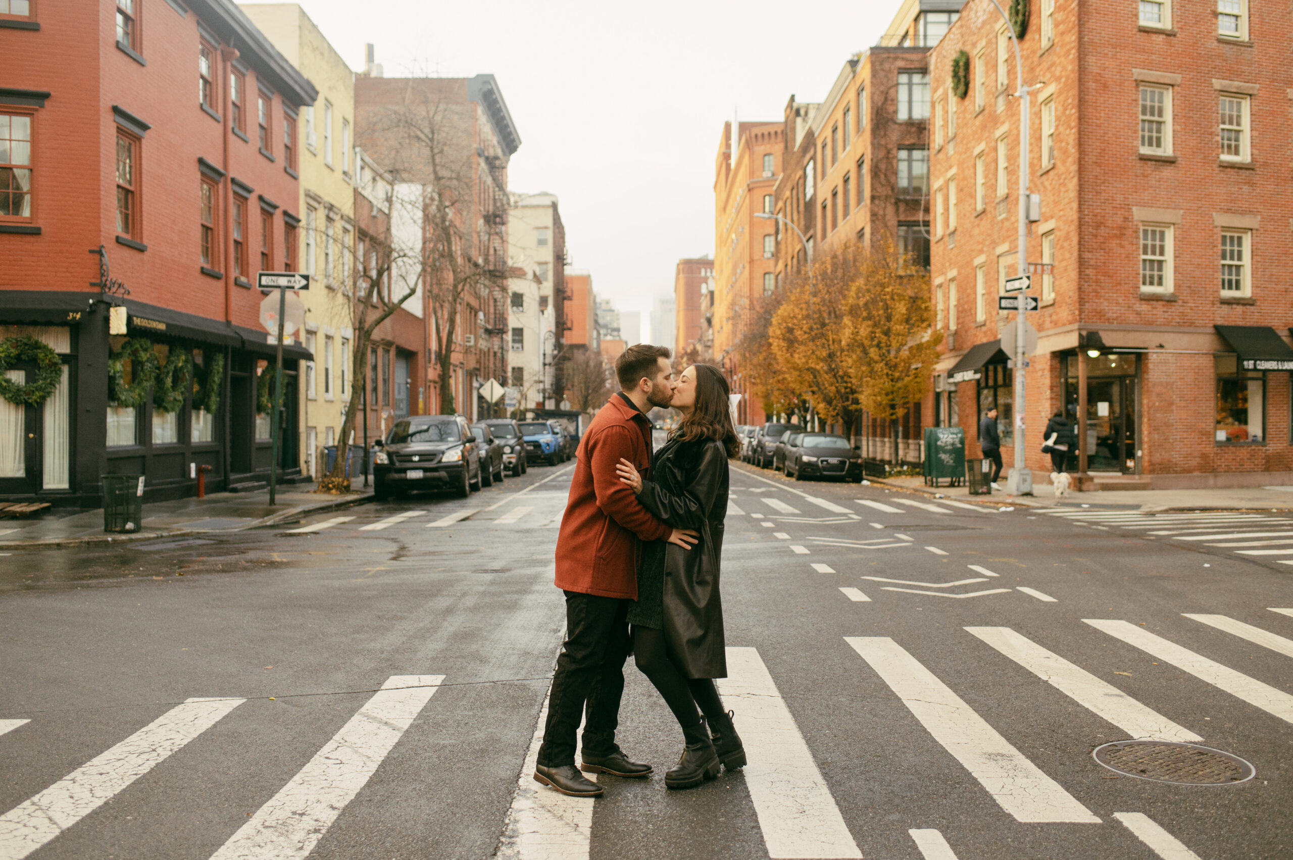A couple kissing in the streets of Greenwich Village in New York City.