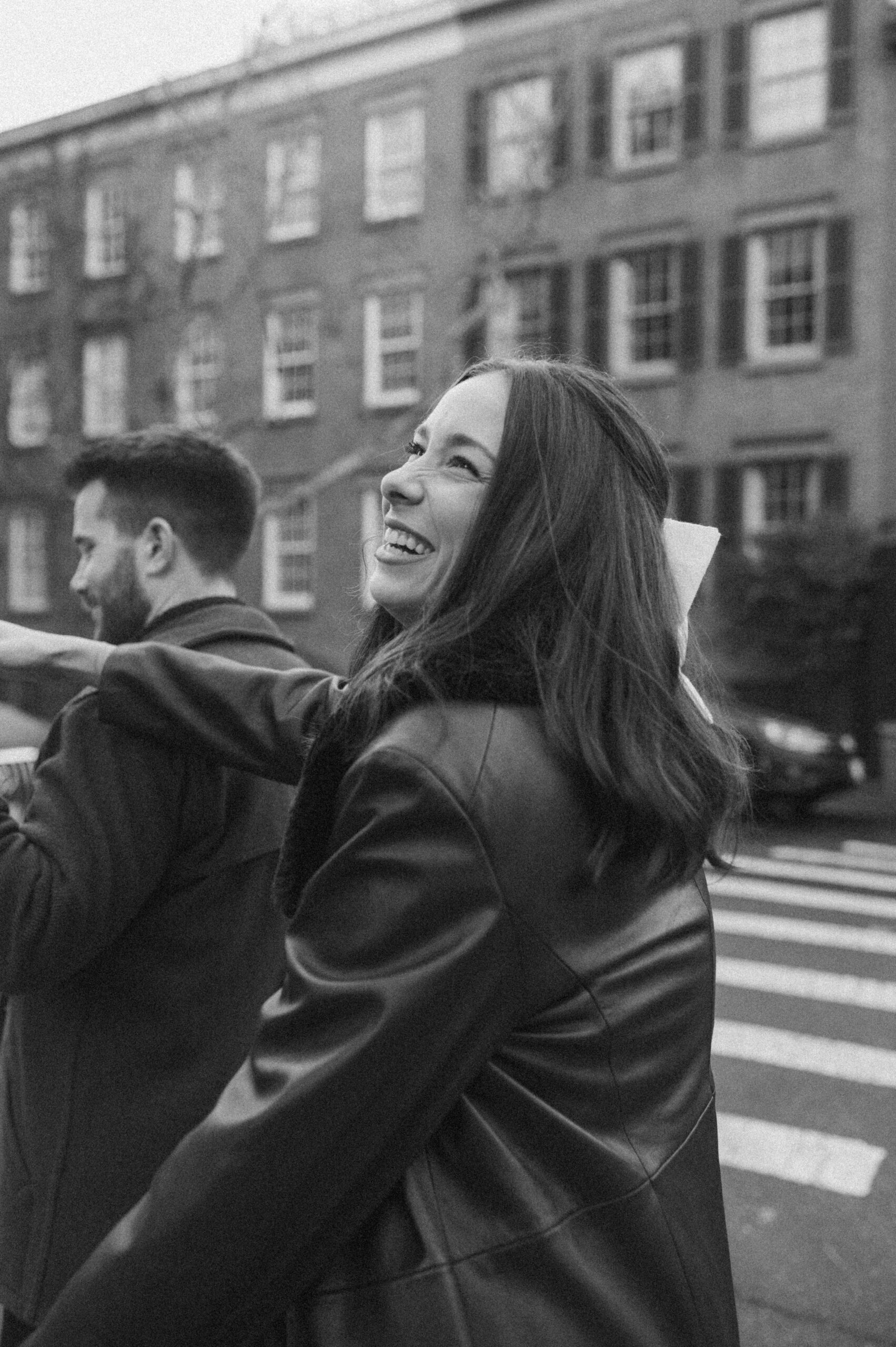 A couple laughing in the streets of Greenwich Village